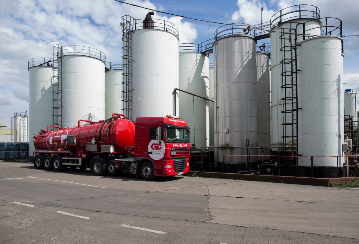 CSG Truck in front of storage tanks